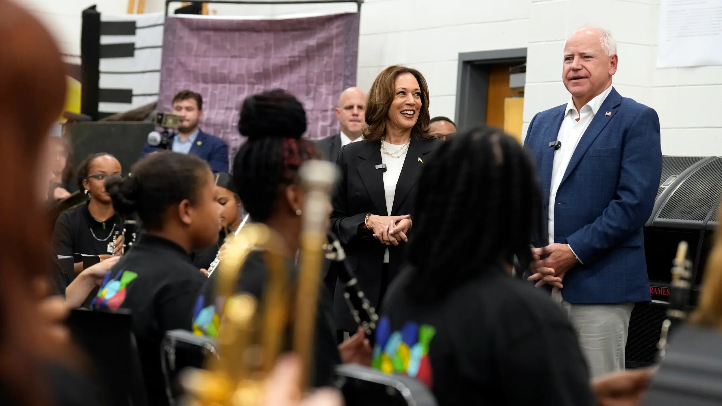 Kamla Harris and Tim Walz visit a school music classroom