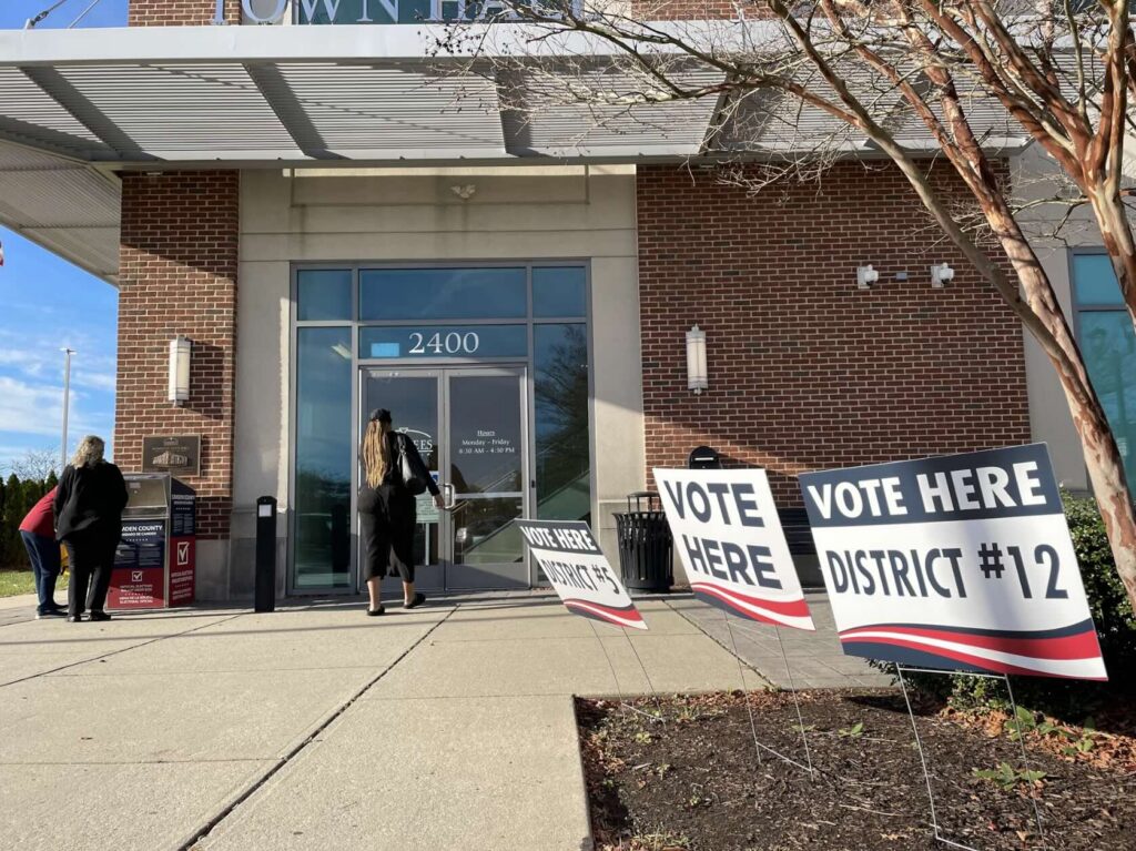 A woman walks into a polling place